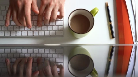 Office-worker typing on desktop computer keyboard working in office. Closeup Stockbeeldmateriaal 104991149