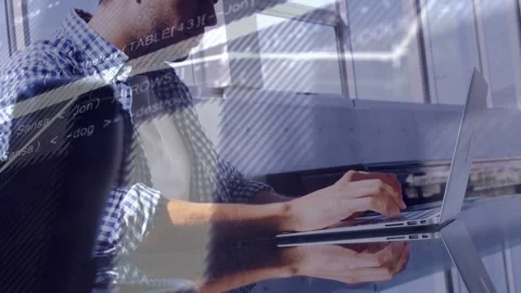 Office worker typing on laptop and initiating sliding software and line charts Stock Footage 335739904