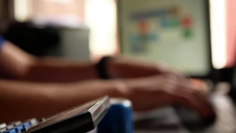 Office worker typing on laptop computer keyword Stock Footage 113332561