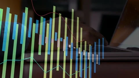 Office worker typing laptop keys, showing finance data with bars growing right Stock Footage 328446618
