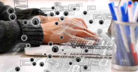 Office worker typing on laptop summoning chat bubbles and streaming data for 스톡 동영상 310406484