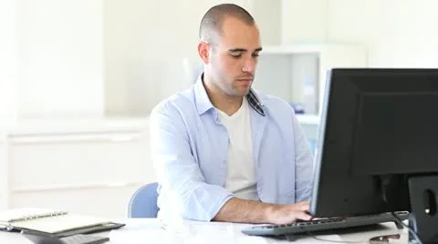 Office worker typing report on computer Video stock 14832848