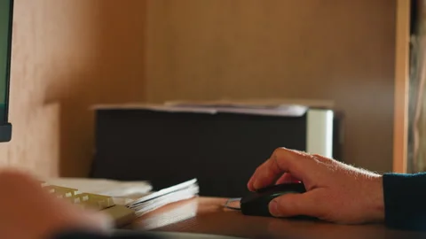 Office worker uses mouse working on computer at desk Vídeo Stock 243304759