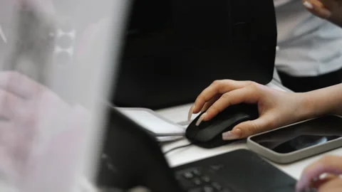 Office worker using computer mouse during data entry workflow. 스톡 동영상 347777213