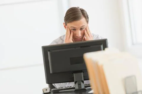 Office worker using computer Stock Photos