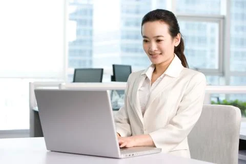 Office worker using her computer Stock Photos