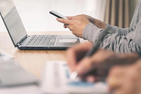 Office worker using his mobile phone in the office. Business concept Stock Photos