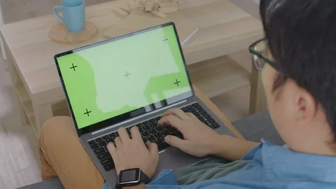 Office Worker Using Laptop with Green Screen on Lap Stock Footage 124855842