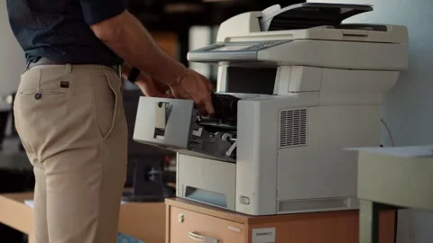 Office Worker Using Multifunction Printer Scanning Documents in Modern Workplace 動画素材 260821926