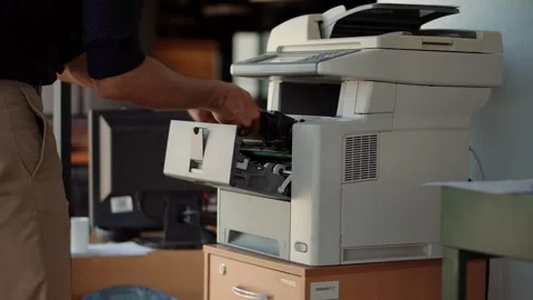Office Worker Using Multifunction Printer Scanning Documents in Modern Workplace 動画素材 260821992