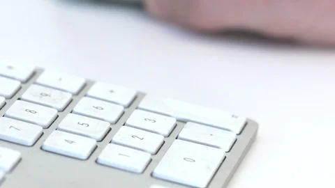 Office worker using the number pad on a keyboard Stock Footage 92525272