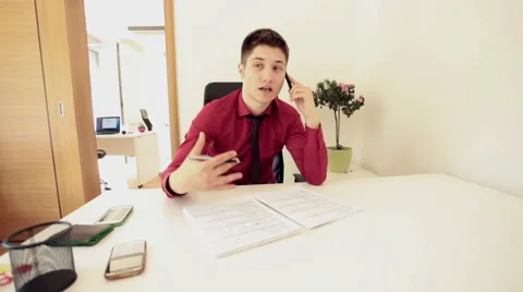 Office worker using smartphone Stock Footage 62638785