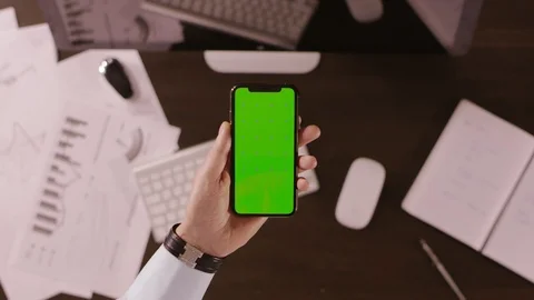 An office worker is using a smartphone Stock Footage 102706863
