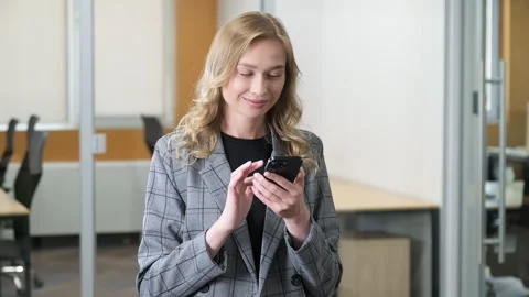 Office worker using smartphone at office. Stock Footage 279867300