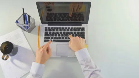 Office worker very slowly typing text Stock Footage 81476694