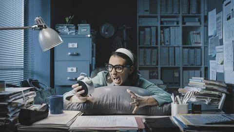 Office worker waking up in the office Stock-Fotos