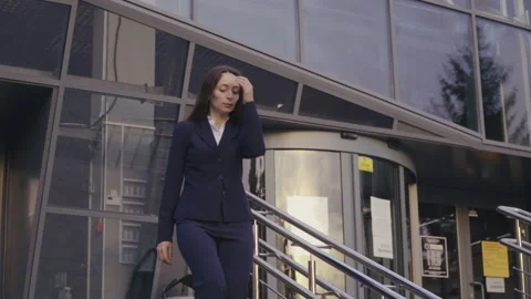 Office worker walking down the Stairs Video stock 136460640