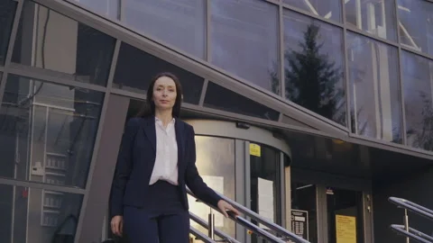Office worker walking down the Stairs Stock Footage 136460816