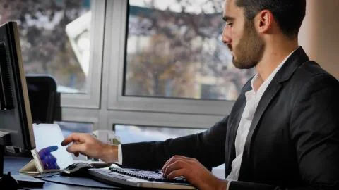Office worker watching tablet at workplace Stock Photos