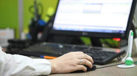 Office worker working at a computer in the workplace Stock Footage 67468462