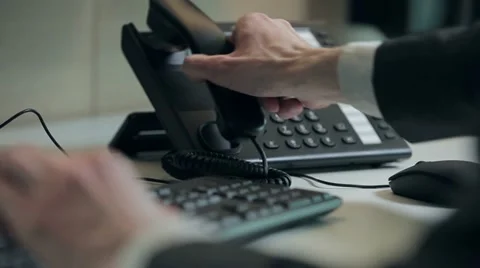 Office worker at the workplace calls by phone Video stock 10923080