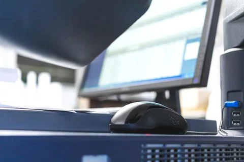 Office worker workplace with wired mouse and old screen. Concept of industria Stock Photos