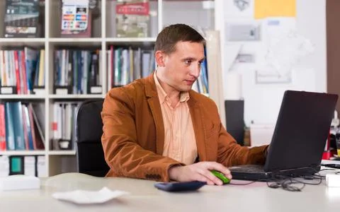 Office worker works at a computer Stock Photos