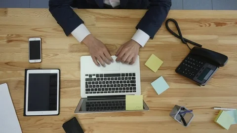 Office worker writing idea on sticker and brainstorming at workplace, top view Stock Footage