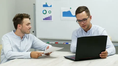 Office workers actively discuss a project, come to an agreement, working on a Video stock 142924385