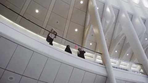Office workers and engineers debating on the balcony of a modern company Stock Footage 136207787