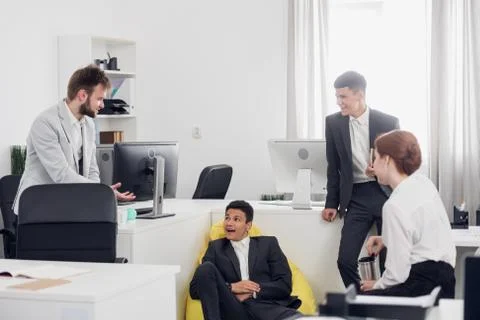 Office workers are talking during working day in the office Stock Photos
