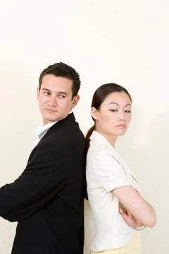 Office workers back to back Stock Photos