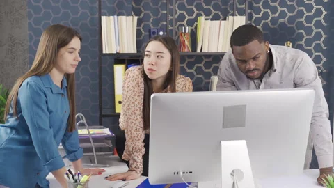 Office workers of different races work together in the office. Stock Footage 228805542