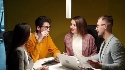 Office workers discuss start-up project in conference room with charts, laptop Video stock 197486800