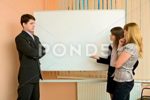 Office workers discuss work Stock Photos