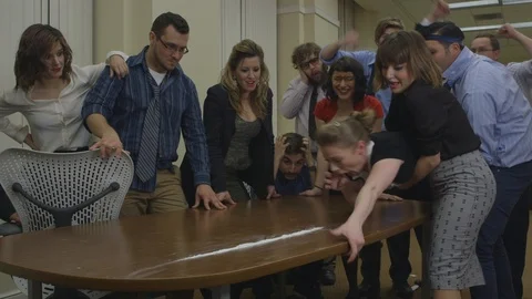 Office workers doing drugs off of a table during a party Stock Footage 117109167