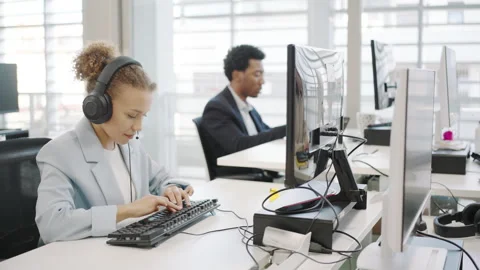 Office Workers Engaged in Collaborative Activities within a Contemporary Work Stock Footage 280629819