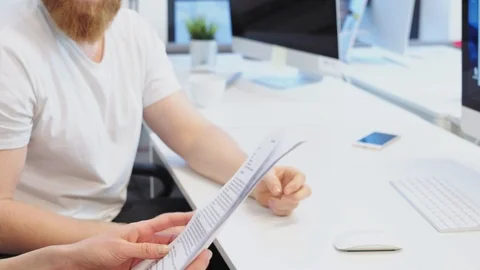Office workers examining files Stock Footage 96497940