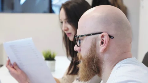 Office workers examining files Stock Footage 96501578