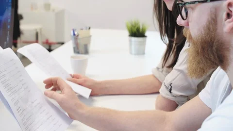 Office workers examining files 스톡 동영상 96506718