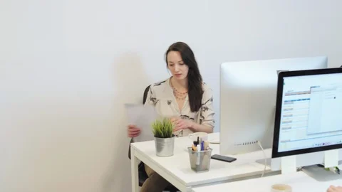 Office workers examining files Video stock 96509708