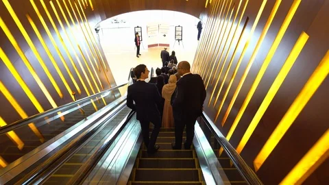 Office Workers Going Down the Escalator 스톡 동영상 116250283
