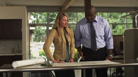 Office Workers Look at Blueprints Front Stock Footage 62921748