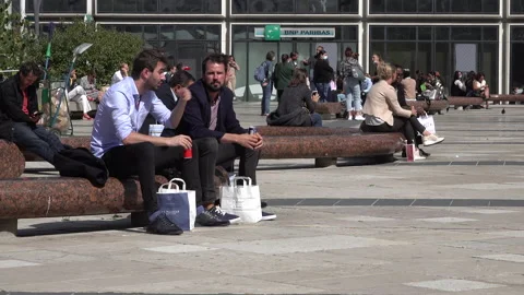 Office workers on lunch break in Paris business district during Covid pandemic Stock Footage 139748663