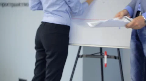 Office workers prepare for presentations to management, distribute documents and Vídeo Stock 65743968