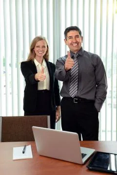 Office workers showing the thumbs up Stock Photos