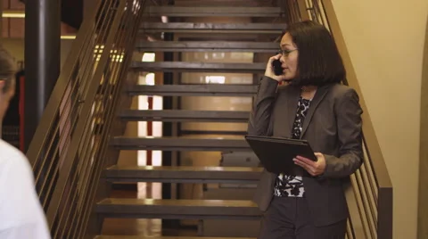 Office workers talking in hallway Video stock 67352150