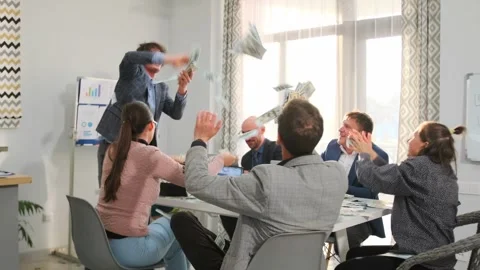 Office workers throwing cash in celebration of big deal 스톡 동영상 316024259