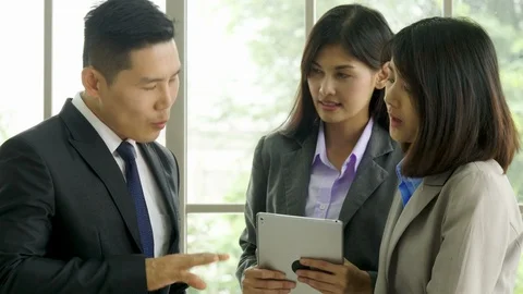 Office workers using digital tablet in their office. Video stock 86627528