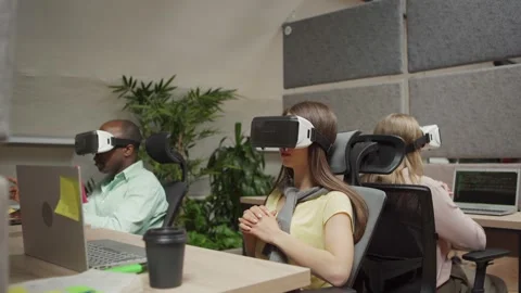 Office workers in VR googles talking in office Stock Footage 142540875
